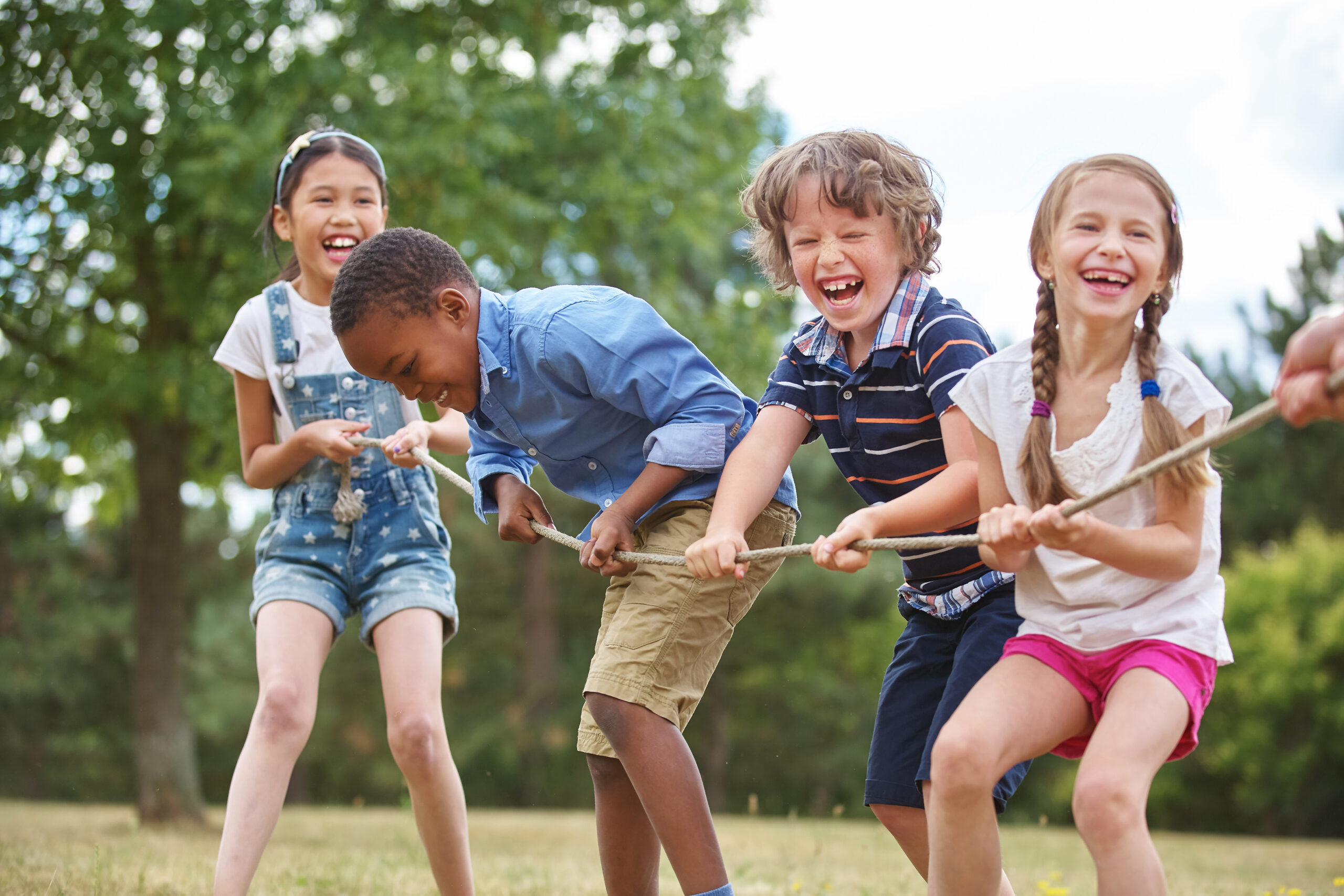 Children,Playing,Tug,Of,War,At,The,Park